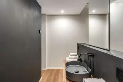 a bathroom with a sink and a mirror at Suite Orsoline Spanish steps in Rome