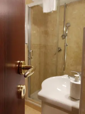 a bathroom with a toilet and a sink and a shower at Domina Popolo in Rome