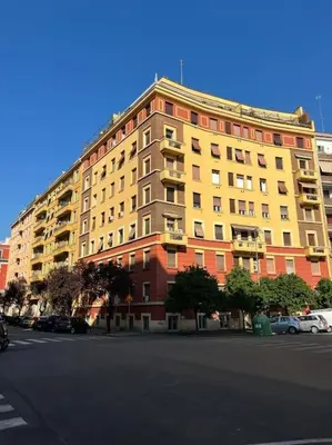 a large apartment building on the side of a street at Domus Modista (Musei Vaticani) in Rome