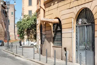 a row of poles on the side of a building at Retro Flat Termini in Rome