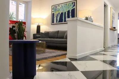 a dining room with a wooden table and chairs at Trevi Fountain Luxury Flat in Rome