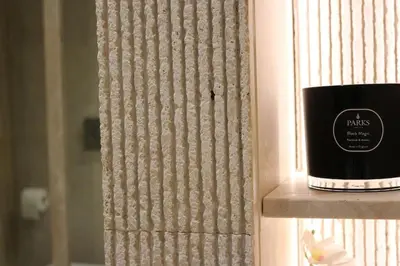 a bathroom with a white bowl sink and a toilet at Trevi Fountain Luxury Flat in Rome