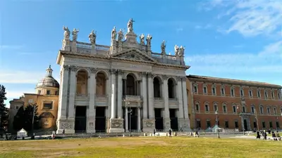 a large building with a dome in front of it at Lovers' Nest - Spa Apartment in Rome