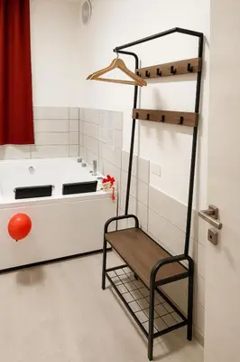 a kitchen with a ladder and a bench in a room at Lovers' Nest - Spa Apartment in Rome