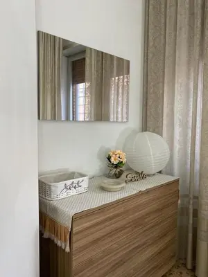a mirror on top of a dresser in a bathroom at Semini di nostalgia in Rome