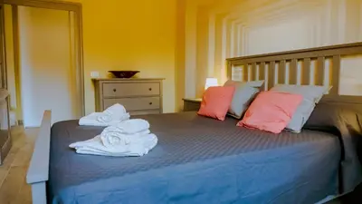 a bedroom with a bed with towels on it at Charme Retreat Boki in Rome