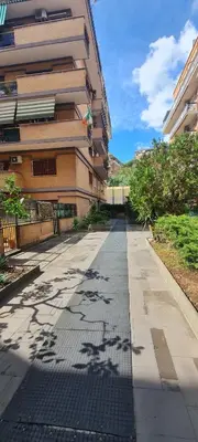 an empty sidewalk in front of a building at La Casa di Carmine in Rome