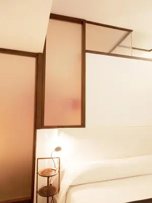 a bedroom with a bed and a mirror at Trastevere Art House in Rome