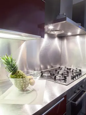 a kitchen with a pineapple in a bowl next to a stove at Trastevere Art House in Rome
