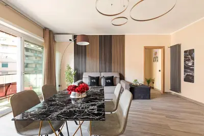 a dining room with a table and a couch at Charming Trastevere One in Rome