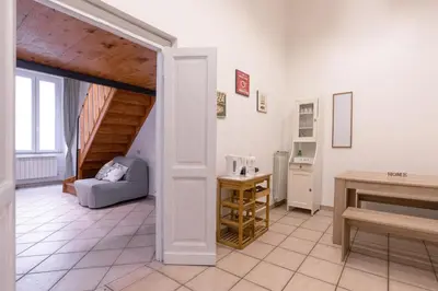 a living room with a couch and a table at vatican apartment gianicolo in Rome