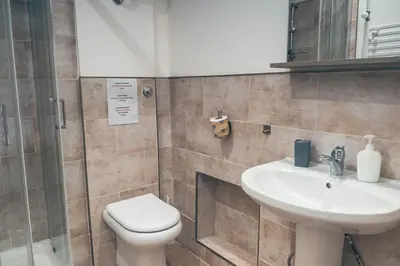 a bathroom with a toilet and a sink at Eureka Rooms in Rome