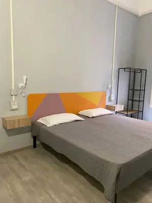 a bedroom with a large bed in a room at Eureka Rooms in Rome