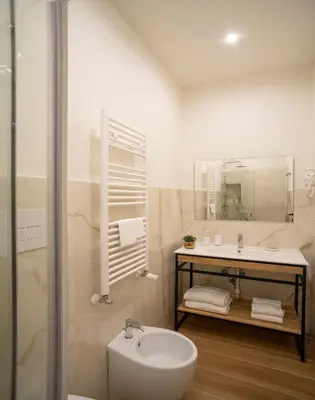 a bathroom with a sink and a toilet and a shower at ElevenG in Rome