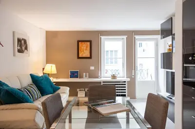 a living room with a couch and a table at Lovely Cozy Apartment Parioli in Rome