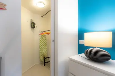 a lamp sitting on top of a dresser in a room at Lovely Cozy Apartment Parioli in Rome