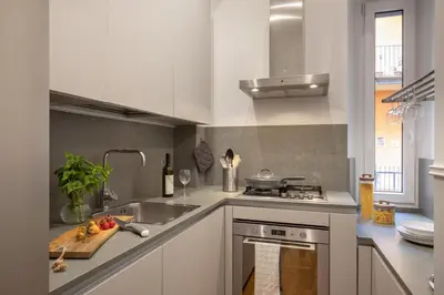 a kitchen with a sink and a stove top oven at St.Peter's1928 in Rome