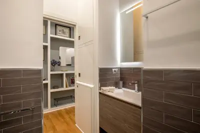 a bathroom with a sink and a mirror at St.Peter's1928 in Rome