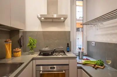 a kitchen with a stove with a pan on it at St.Peter's1928 in Rome