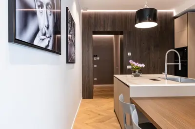 a kitchen with a sink and a counter at La Dolce Vita Luxury Apartment in Rome