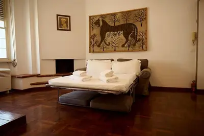 a room with a bed with towels on it at Riboty 21 in Rome