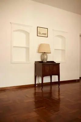 a room with a table with a lamp on it at Riboty 21 in Rome