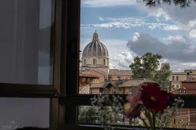 a view from a window of a building with a dome at The Little Big House in Rome