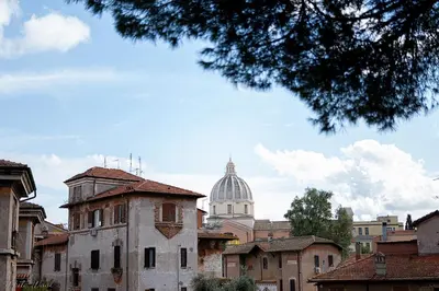 a view of a city with a cathedral in the background at The Little Big House in Rome