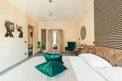 a bedroom with a large bed and a couch at Charming Trastevere Two in Rome
