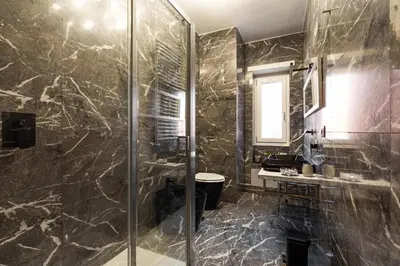 a bathroom with a shower and a sink at Charming Trastevere Two in Rome