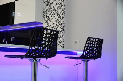 two black chairs in front of a counter at Black & White G&G in Rome