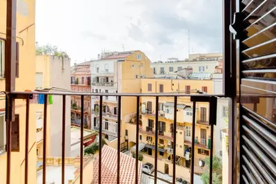 a balcony with a view of buildings at Vinylogy Apartment 5to Piano in Rome