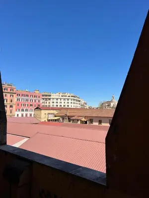 a view of a roof with buildings in the background at Apartment - Laterano 85 in Rome