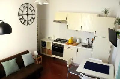 a small kitchen with a sink and a stove top oven at Apartment - Laterano 85 in Rome