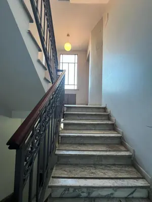 a staircase in an old building with a window at Apartment - Laterano 85 in Rome