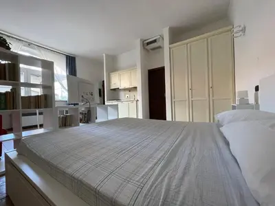 a large bedroom with a large bed in it at Gens Julia in Rome
