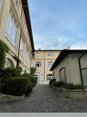 a building with a walkway in front of it at Gens Julia in Rome