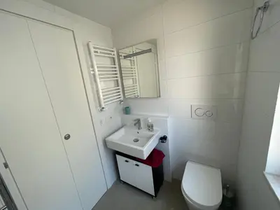 a white bathroom with a sink and a toilet at Little Aventino BnB in Rome