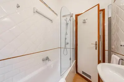 a bathroom with a shower and a tub and a sink at Studio Suite Aurelia Antica in Rome