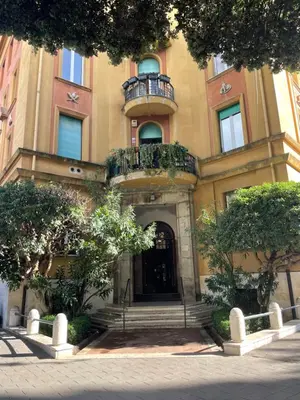 a building with a balcony on the front of it at Montezebio Boutique Apartment in Rome
