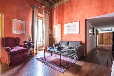 a living room with a couch and a table at Suite Palazzo Bonaventura in Rome