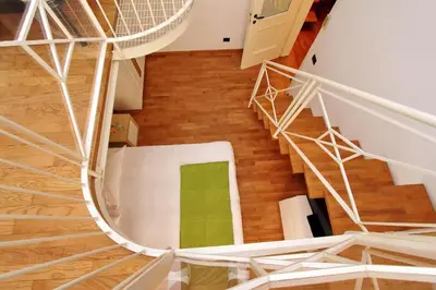 an overhead view of a spiral staircase in a house at Vatican Holiday Home in Rome