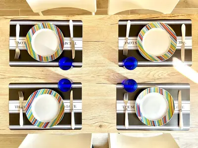 a set of plates on a table at Casa Minerva a Testaccio in Rome