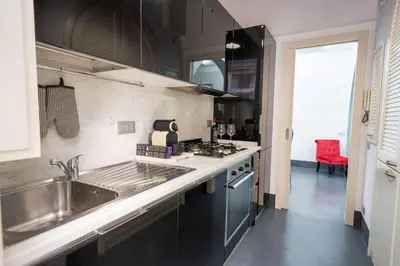 a kitchen with a sink and a counter top at White Style Gambero in Rome