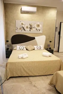 a bedroom with a bed with two towels on it at Jadore Monic in Rome