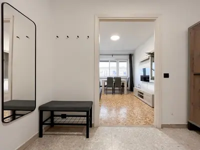 a living room with a mirror and a table at Horizon - Concept Apartment in Rome