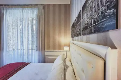 a bedroom with a bed and a window at Star Vatican Rooms in Rome