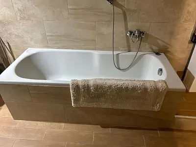 a white bath tub in a bathroom with a shower at DOLCEVITA PONTE MILVIO in Rome