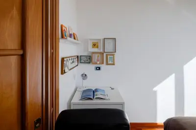 a room with a desk with two books on it at Domus Alberone in Rome