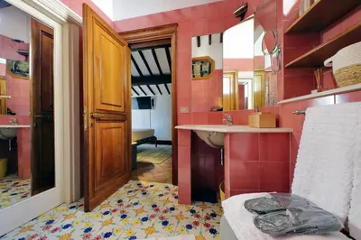 a bathroom with a sink and a mirror at Rooftop SUITE - FORO ROMANO LUX in Rome